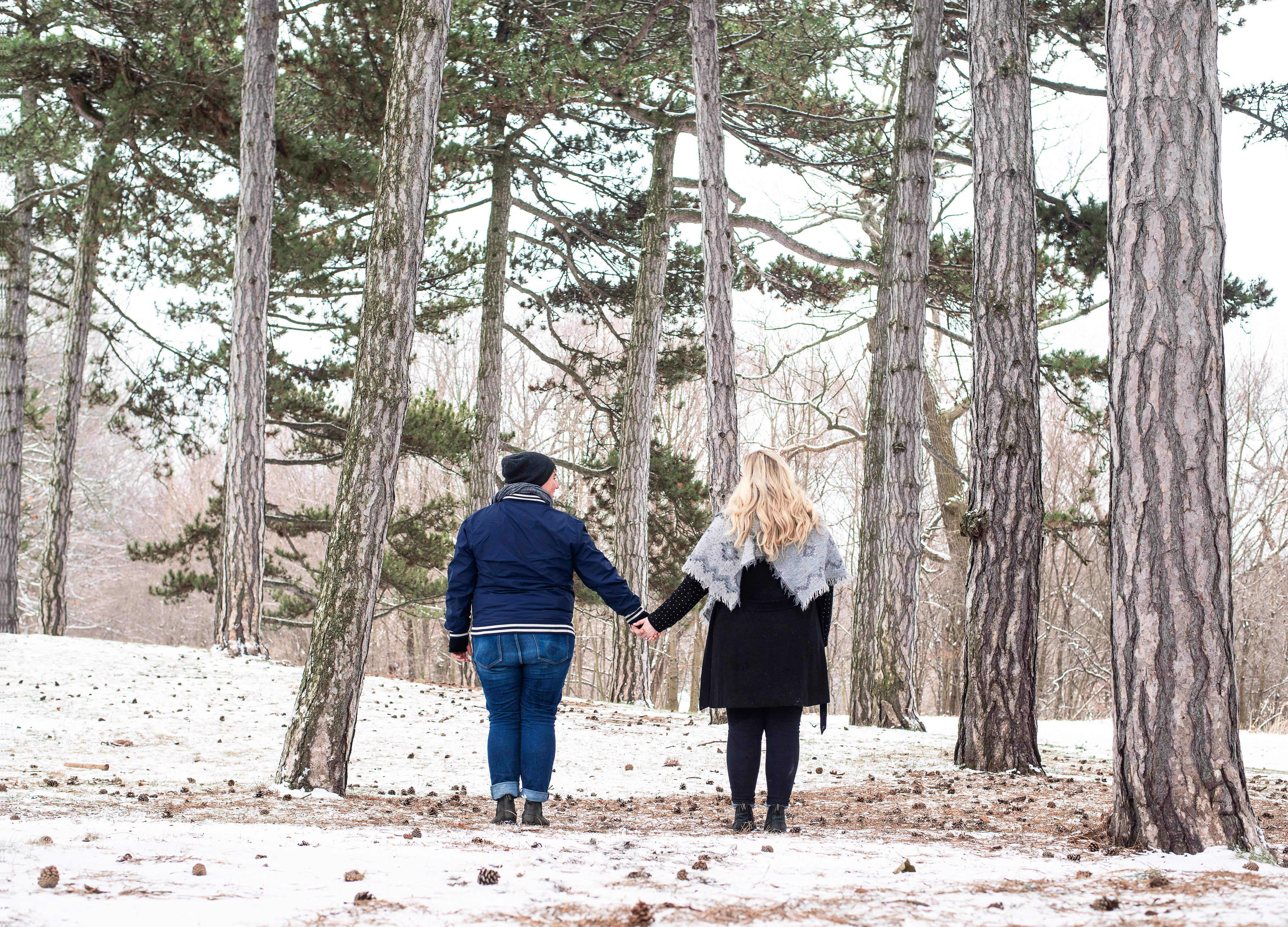 files/two-women-hold-hands-in-the-snowy-woods.jpg